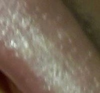 a close up of a person's tongue